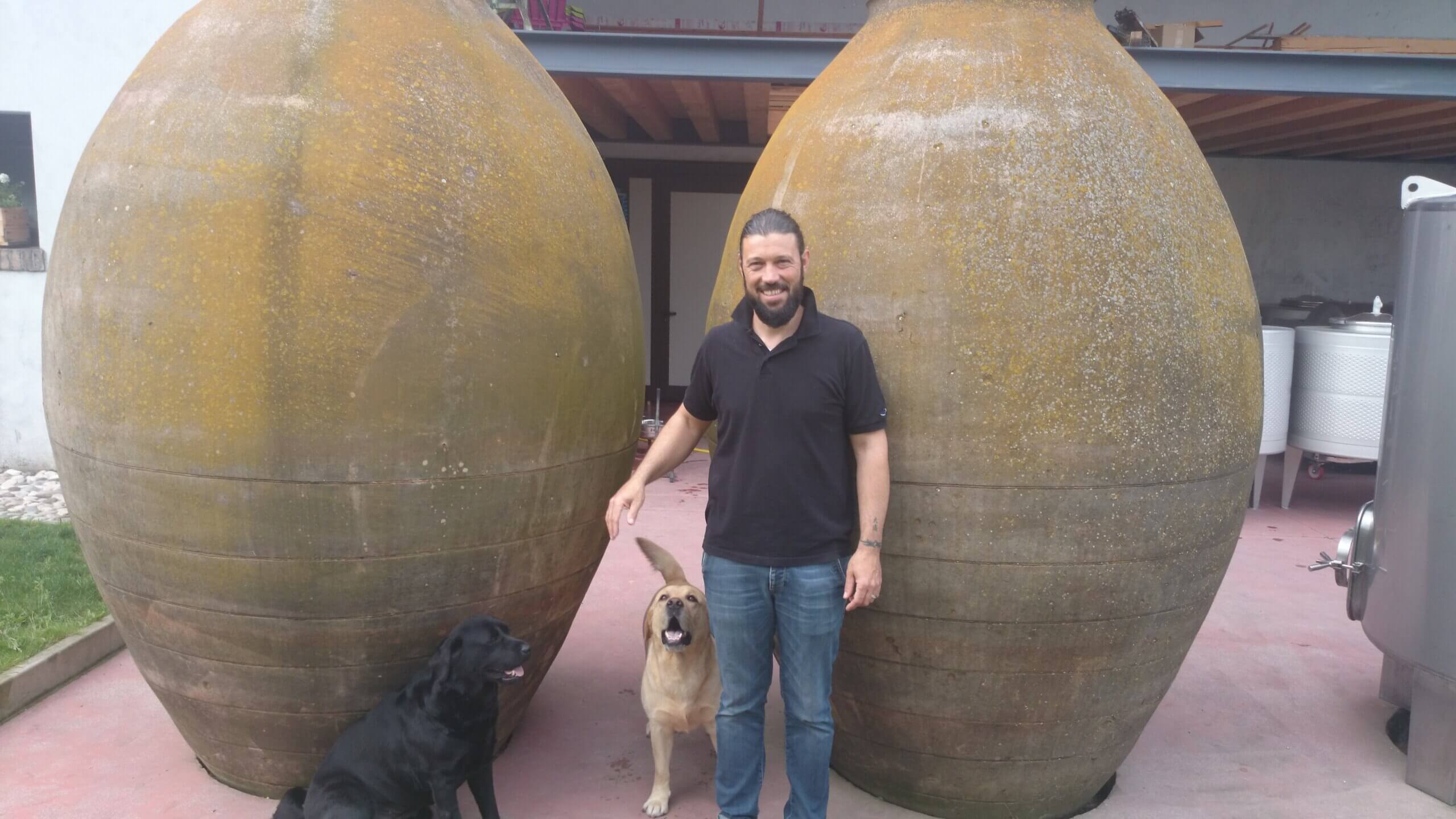 Big anfore Casa Belfi outside with owner Maurizio